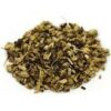 A pile of dried herbs on top of a white plate.