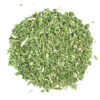 A pile of green leaves on top of a white surface.