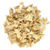 A pile of dried ginger on top of a white surface.