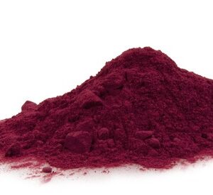 A pile of red powder on top of a white surface.